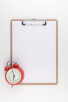Creative top view mock up of workspace desk styled recycled empty clip board with copy space white table background minimal eco style. Concept start up or new day. Presentation, design, text template
