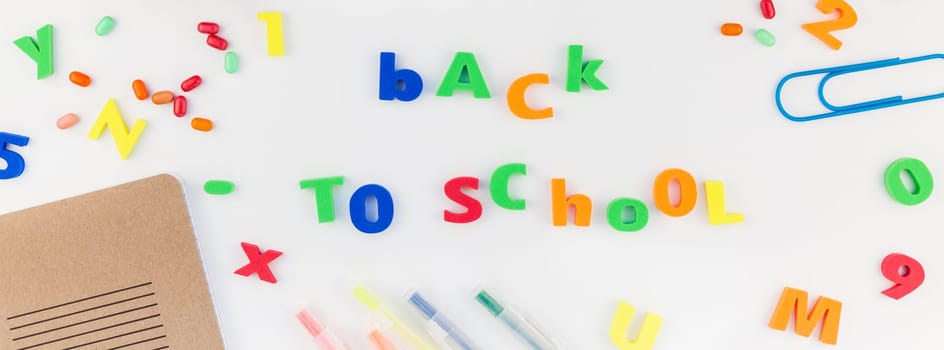Long wide banner back to school concept with color school and office supplies on white table background with copy space, frame, template for text or design