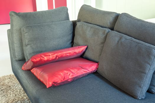 Modern apartments cozy furniture: a sofa with pillows