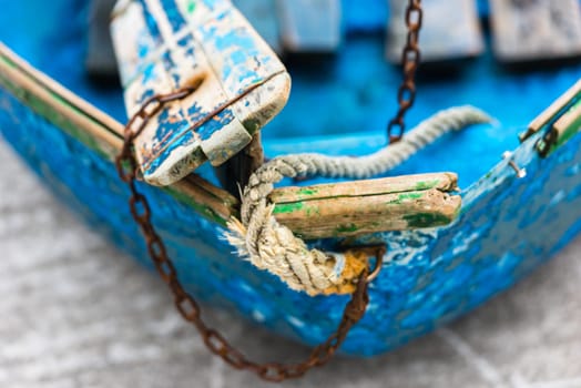 Old blue wooden shabby fishing boat detail. Shot with a selective focus