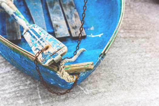 Old blue wooden shabby fishing boat detail. Shot with a selective focus