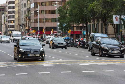 SPAIN, BARCELONA - SEPTEMBER 12: Cars traffic on Barcelona street on September 12, 2015