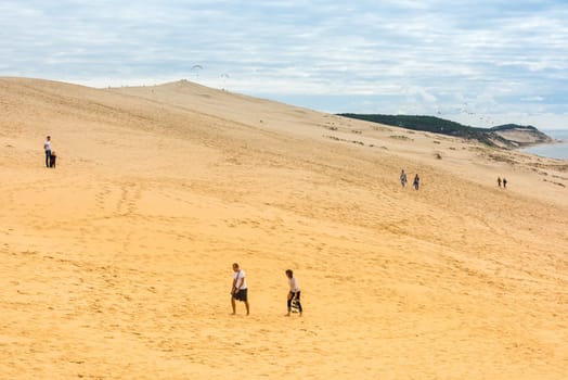 FRANCE, LA TESTE-DE-BUCH - SEPTEMBER 19: people visiting the famous highest sand dune in Europe Dune of Pyla on September 19, 2015
