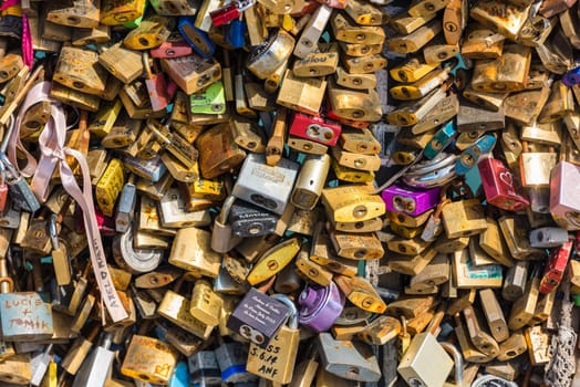 FRANCE, PARIS - JUNE 01: Pont des arts - bridge across Seine river crammed with lovers padlocks on June 01, 2015.