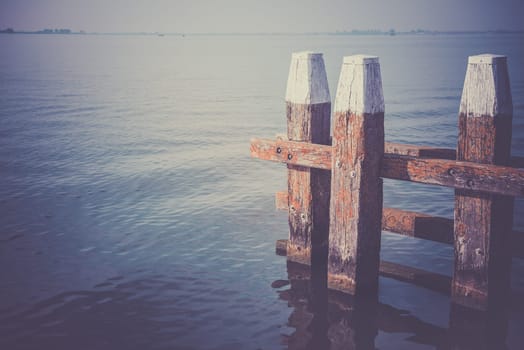 Northern Sea landscape: still water and wooden pier
