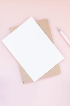 Top view flat lay of workspace desk styled design office supplies with copy space millennial pink color paper background minimal style. Template for feminine blog social media