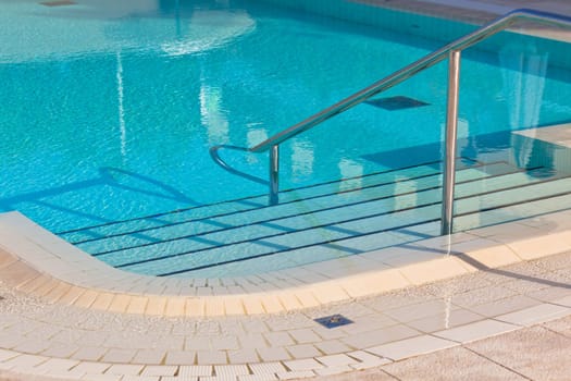 Outdoor Swimming pool with staircase. Horizontal shot