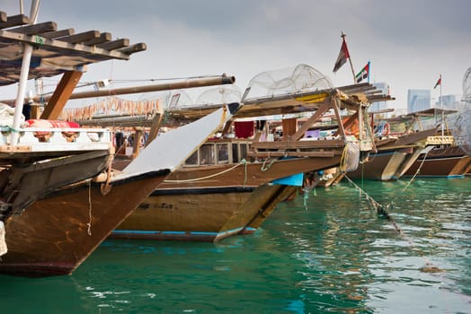 Old fishing boats in Abu Dhabi, UAE. Overcast day
