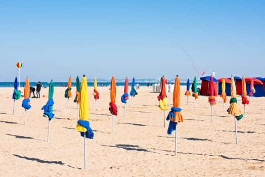 The famous colorful parasols on Deauville beach, Normandy, Northern France