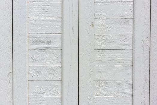 window with closed beige wooden shutters. background photo