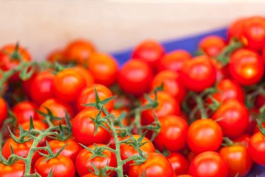 Natural organic tomatoes in boxes on farmer's market