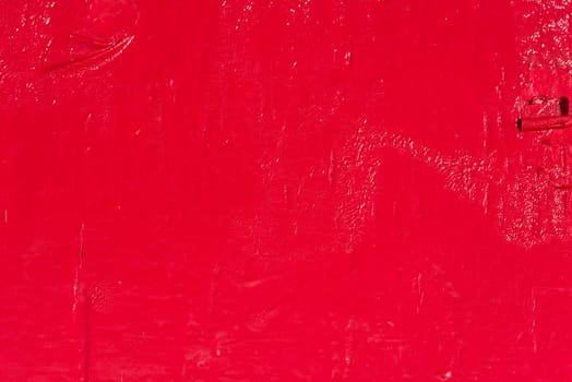 Bright red painted surface background. Horizontal shot