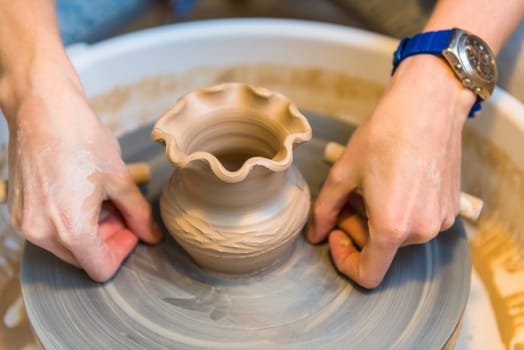 Pottering - creating a clay cup in process. Shot with a small GRIP