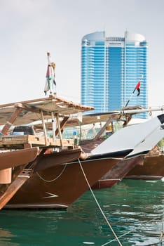 Old fishing boats in Abu Dhabi, UAE. Overcast day
