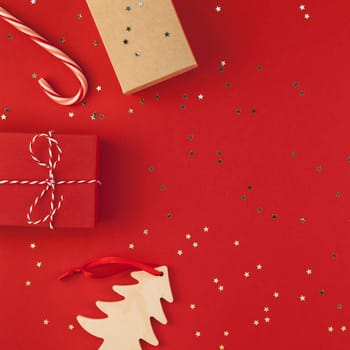 New Year Christmas presents ribbon flat lay top view Xmas holiday 2019 celebration handmade gift boxes red paper golden sparkles background copyspace. Square Template mockup greeting card text design