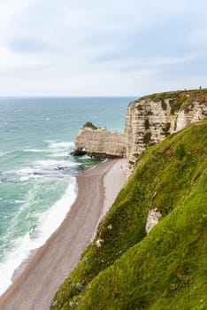 The beach and stone cliffs in Etretat, France, Normandy
