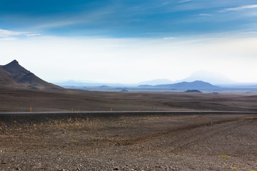 Dry Gravel field landscape under a blue summer sky. Highlands of Central Iceland.