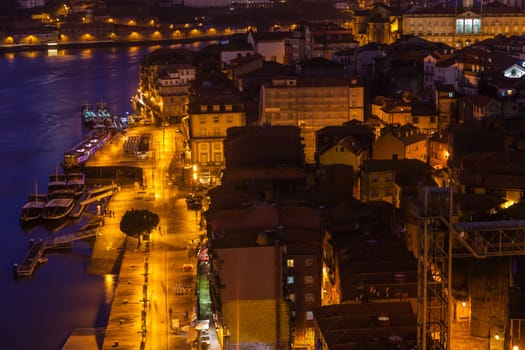 Overview of Old Town of Porto, Portugal at night. Ribeira and Douro river