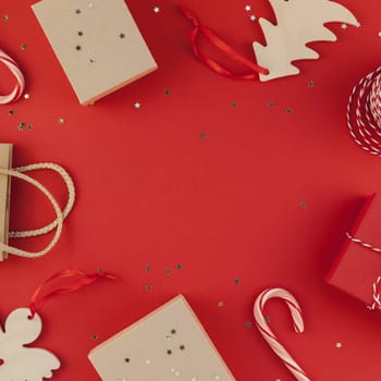 New Year Christmas presents ribbon flat lay top view Xmas holiday 2019 celebration handmade gift boxes red paper golden sparkles background copyspace. Square Template mockup greeting card text design