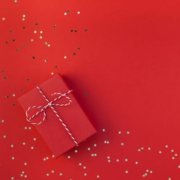 New Year Christmas presents ribbon flat lay top view Xmas 2019 holiday celebration handmade gift box red paper golden sparkles background copyspace. Square Template mockup greeting card text design
