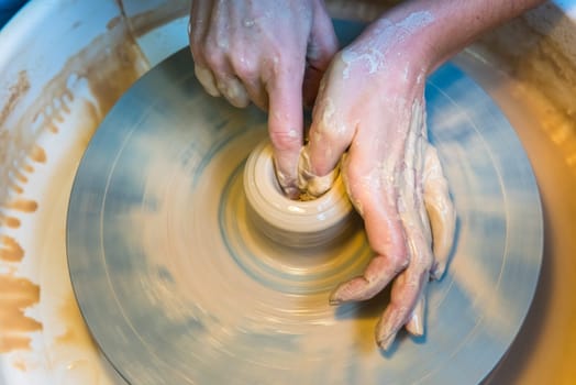 Pottering - creating a clay cup in process. Shot with a small GRIP