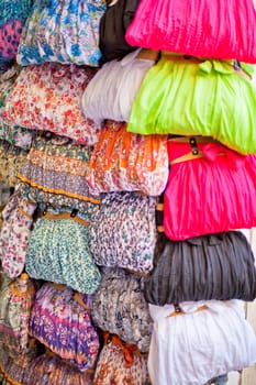 Selection of colorful women scarves at a market
