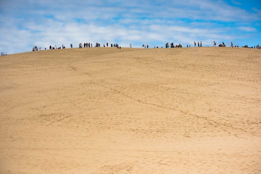People visiting the famous highest sand dune in Europe Dune of Pyla