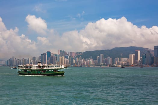 HONG KONG, HONG KONG - SEPTEMBER 22: famous ferry on Victoria harbor in Hong Kong with tall buildings on September 22, 2012