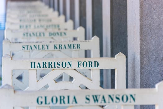 FRANCE, DEAUVILLE - SEPTEMBER 27: original beach closets with famous names on promenade Des Planches in Deauville, France on September 27, 2015