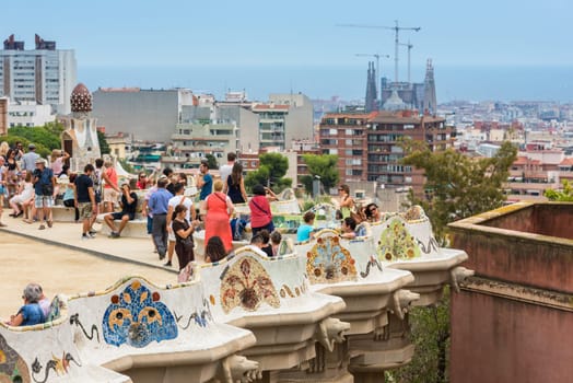 SPAIN, BARCELONA - SEPTEMBER 13: Tourists in Park Guell, Barcelona, Spain on September 13, 2015