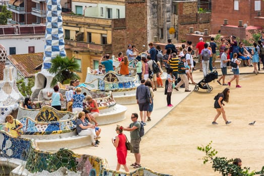 SPAIN, BARCELONA - SEPTEMBER 13: Tourists in Park Guell, Barcelona, Spain on September 13, 2015