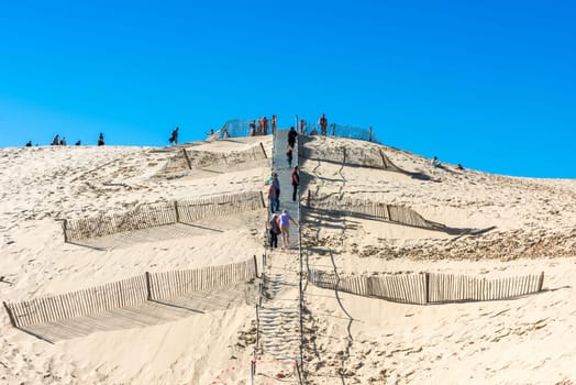 FRANCE, LA TESTE-DE-BUCH - SEPTEMBER 19: people visiting the famous highest sand dune in Europe Dune of Pyla on September 19, 2015