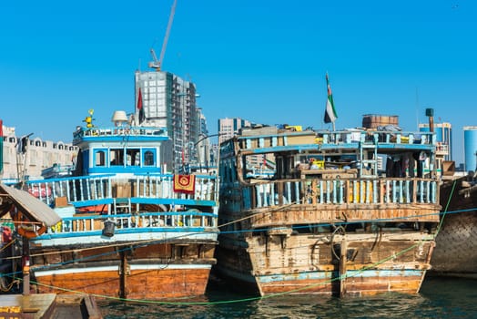 UAE, DUBAI - DECEMBER 27: traditional arabic cargo boats at Dubai creek on December 27, 2014
