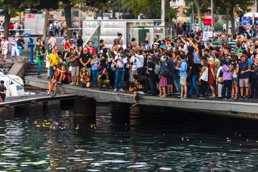 SPAIN, BARCELONA - SEPTEMBER 12: crowd of people on the pier on September 12, 2015