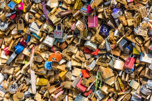 FRANCE, PARIS - JUNE 01: Pont des arts - bridge across Seine river crammed with lovers padlocks on June 01, 2015.