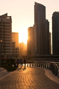 UAE, DUBAI - DECEMBER 31: Skyscrapers silhuette at sunset in Dubai marina on December 31, 2014. Contre jour shot