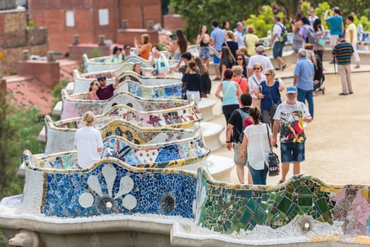 SPAIN, BARCELONA - SEPTEMBER 13: Tourists in Park Guell, Barcelona, Spain on September 13, 2015