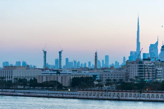UAE, DUBAI - DECEMBER 27: view of Dubai cityscape from Dubai creek bank at night on December 27, 2014