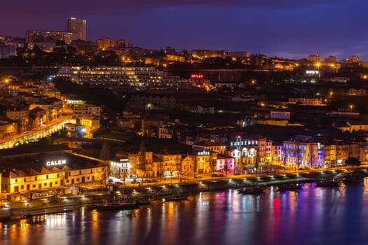 PORTUGAL, PORTO - JANUARY 20: Overview of Vila Nova de Gaia, district of Porto, Portugal at night on January 20, 2013. The world famous Port wine is stored here.
