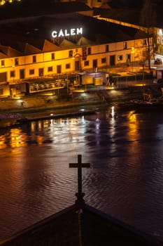 PORTUGAL, PORTO - JANUARY 20: Overview of Vila Nova de Gaia, district of Porto, Portugal at night on January 20, 2013. The world famous Port wine is stored here.