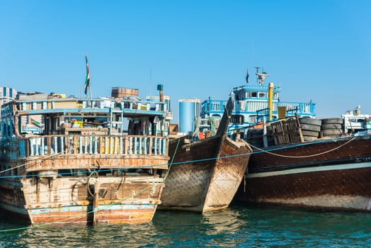 UAE, DUBAI - DECEMBER 27: traditional arabic cargo boats at Dubai creek on December 27, 2014