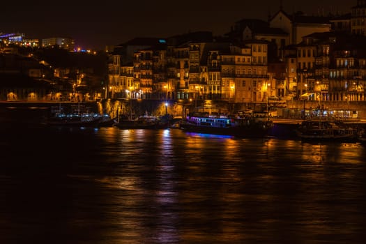 PORTUGAL, PORTO - JANUARY 20: Overview of Old Town of Porto, Portugal at night. Ribeira and Douro river on January 20, 2013