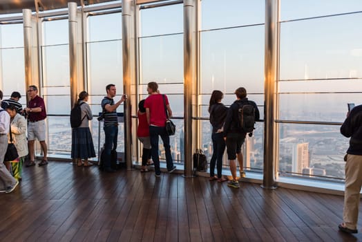 DUBAI, UAE - JANUARY 02: people at the top the observation deck of the highest building in the world Burj al Khalifa on January 02, 2015 in Dubai, United Arab Emirates