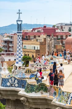 SPAIN, BARCELONA - SEPTEMBER 13: Tourists in Park Guell, Barcelona, Spain on September 13, 2015