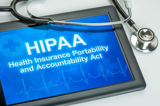 Tablet with the text HIPAA on the display