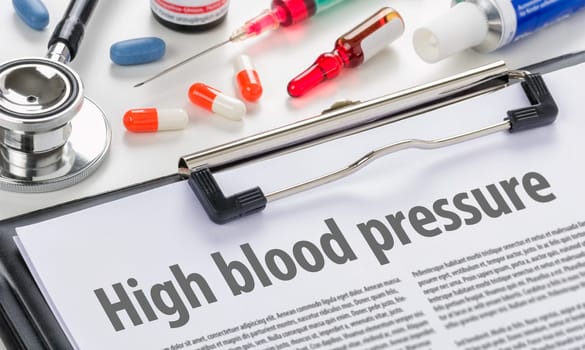 High blood pressure written on a clipboard