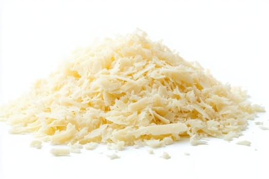 Shavings of Parmesan cheese rest in a central pile against a white backdrop, showcasing their texture and color, ideal for enhancing dishes like pasta, salads, and gourmet recipes.