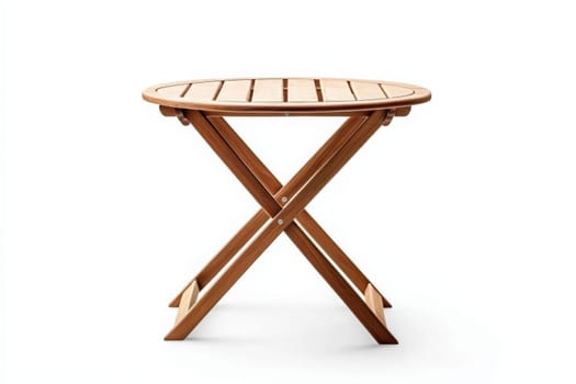 A round wooden patio table stands alone against a white backdrop. Its slatted top and crossed legs suggest a comfortable outdoor setting perfect for gatherings or relaxation.