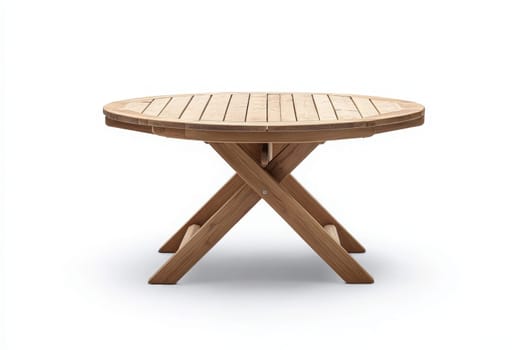 The wooden patio table features a round top and sturdy crossed legs, exuding a minimalist charm. Its design is perfect for outdoor dining or enjoying leisure moments in a sunlit area.