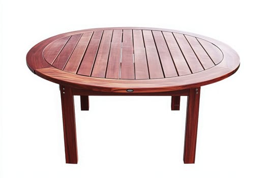 A solitary round wooden patio table stands prominently, showcasing its polished surface and sturdy legs, perfect for intimate gatherings or enjoying meals outdoors in lovely weather.